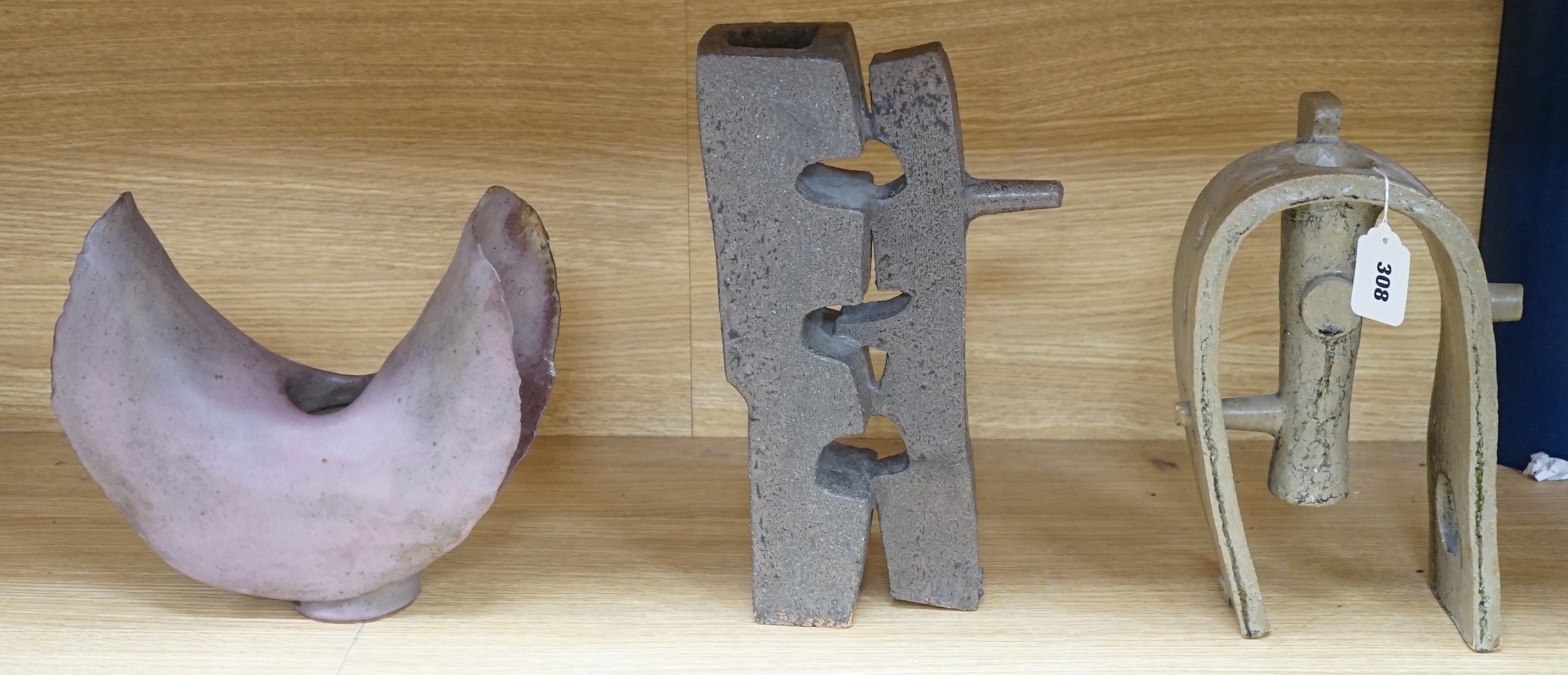 George Wilson (1924-2004), a studio pottery abstract winged vase, together with two Japanese abstract stoneware industrial form vases, two character impressed marks, tallest 35cms high